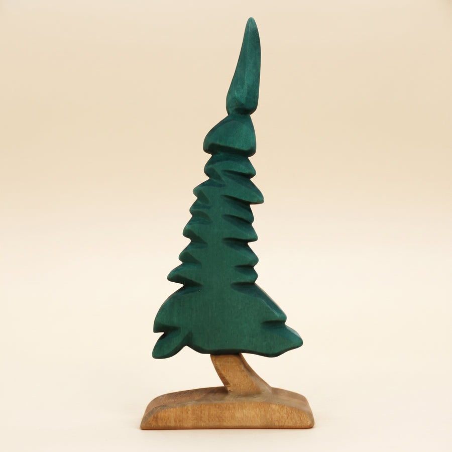 Wooden spruce tree carved in dark green tiers on a short bare trunk and base