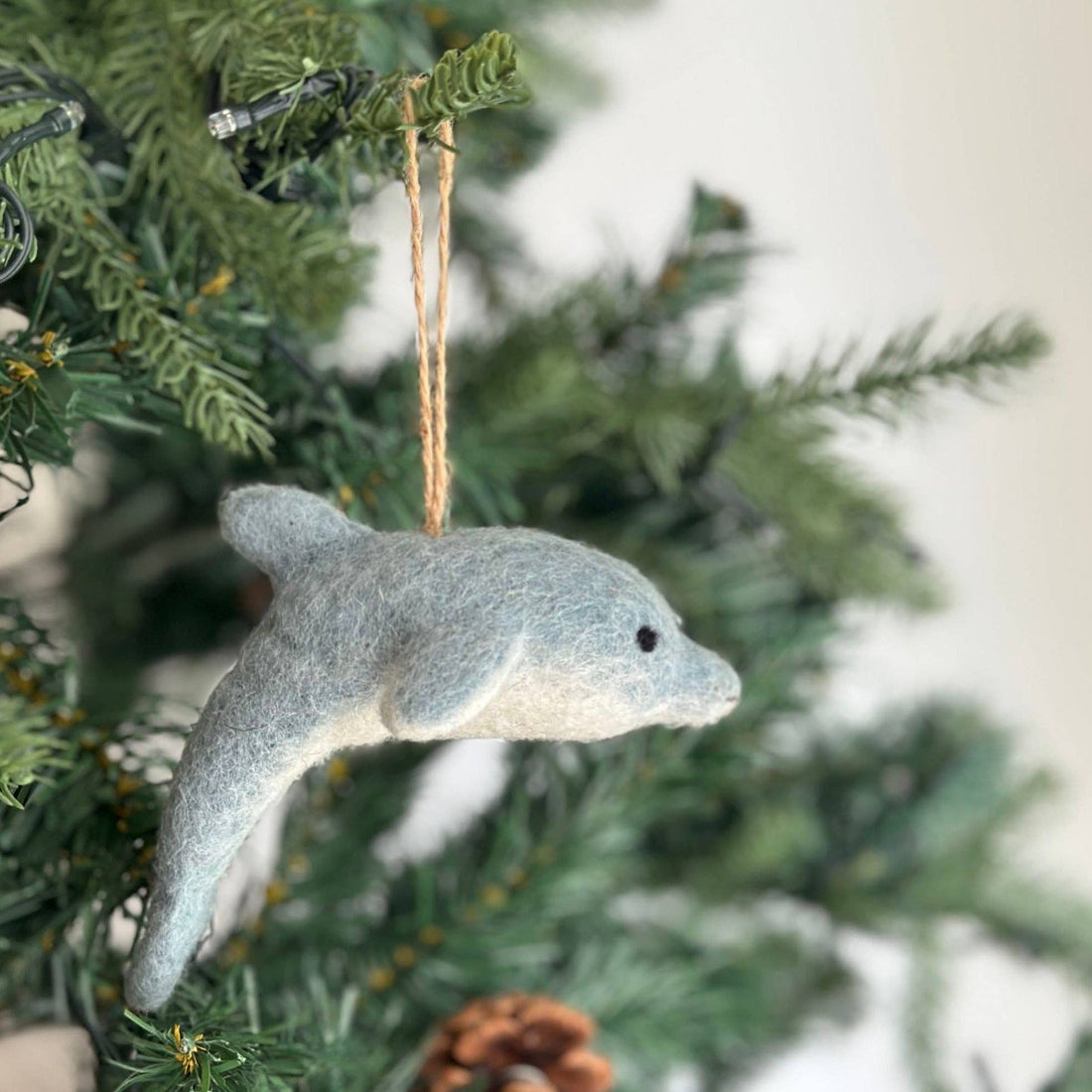 Felt Ornament - Dolphin, a wool felt ornament by Ganapati Crafts Co., needle-felted and hand-stitched in Nepal
