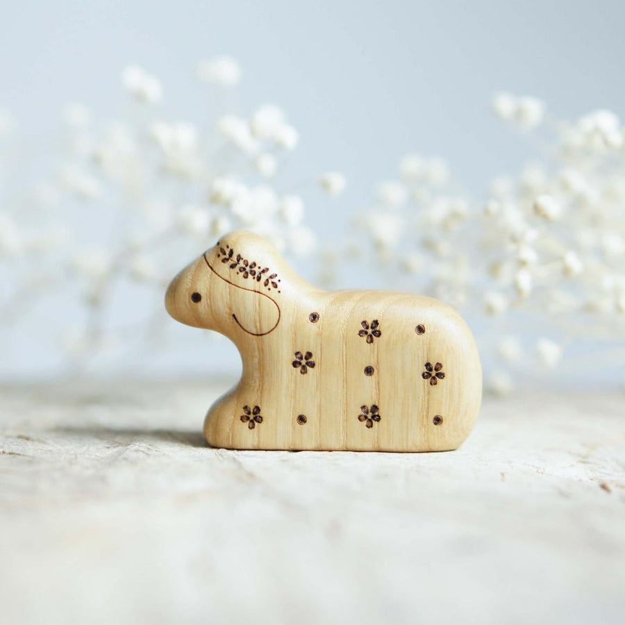 Wooden Lamb, Lying