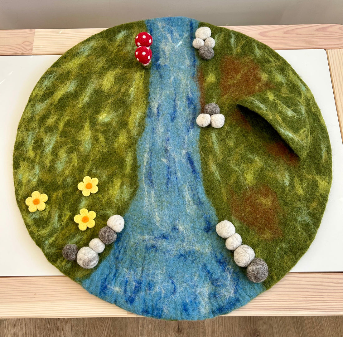 Whimsical felt play mat, storybook-style landscape
