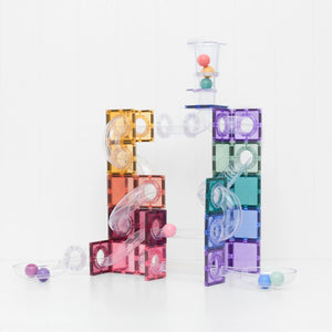 A tall Pastel ball run tower with a staircase and spiral