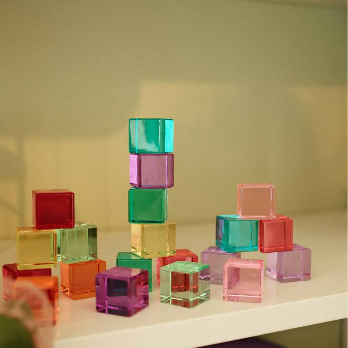 Bauspiel pastel lucent cubes stacked on a shelf