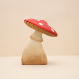 Large wooden toadstool with a red spotted cap that lifts off the pale stem · view 1