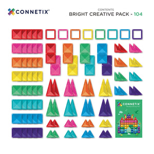 A child building a tall castle from Bright magnetic tiles