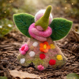 Felted fairy figurine with floral dress on a natural background · view 2