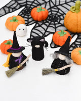 Cloaked felt witch peg doll shown from behind · view 3