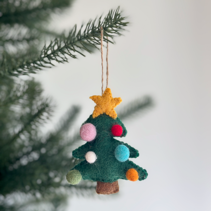 Handmade felt Christmas tree ornament topped with a star