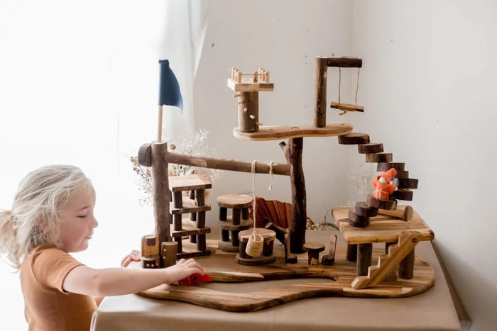 Q Toys Tree House Complex, natural branch play village on a shaped base with swing, stairs and flag