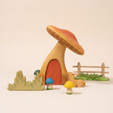 Second view of the wooden toadstool house with the door lifted out · view 2
