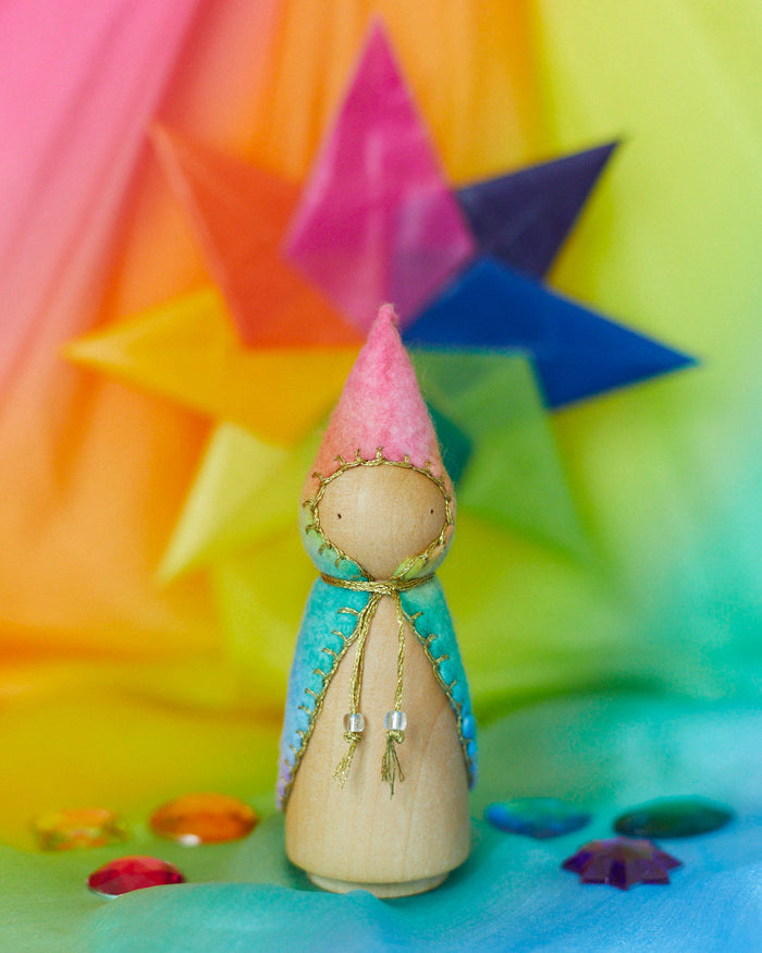 Handcrafted rainbow wooden gnome figure