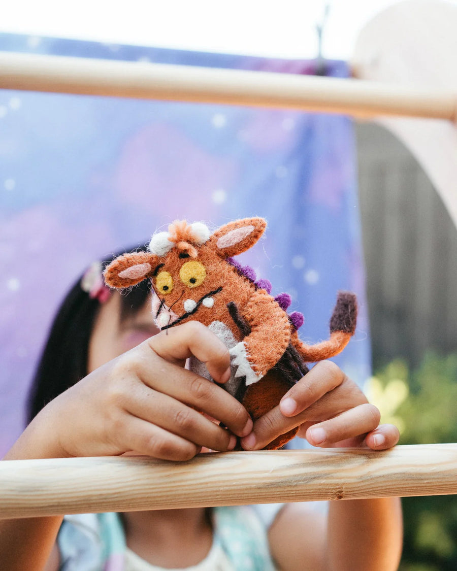 The Gruffalo's Child finger puppets shown on a hand to give a sense of scale