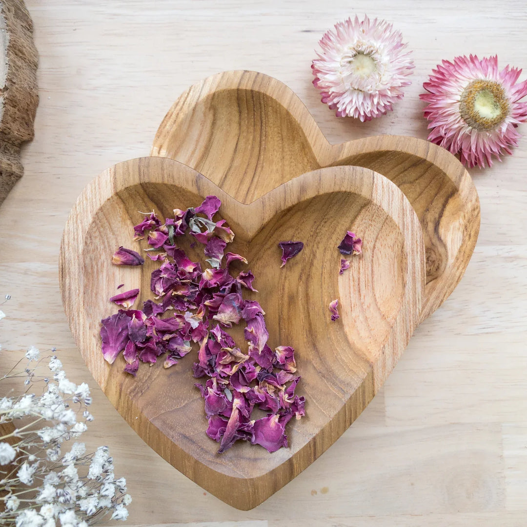 A Papoose heart-shaped teak bowl for holding petals and small dry ingredients