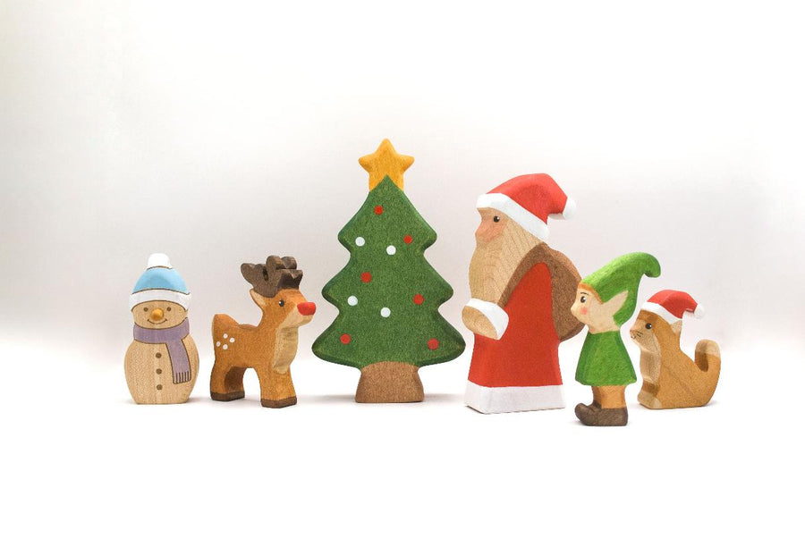 Juharka wooden Christmas figures shown together for scale: snowman, reindeer, tree, Santa, elf and cat