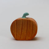 Juharka wooden orange pumpkin with carved ribs and a curled green stem · view 1