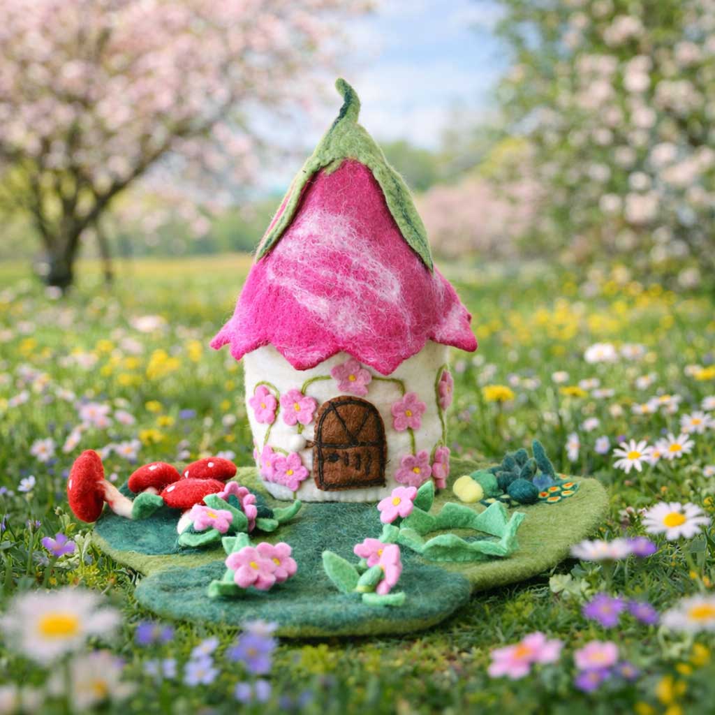 Pink Blossom Fairy House, a hand-felted fairy home with a curled pink petal roof and embroidered cherry blossoms