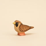 Mako Toys wooden sparrow with a black mask and painted wing markings on a small base · view 1