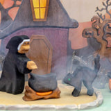 Second view of the wooden witch house set showing the fence and pumpkins in front of the house · view 2