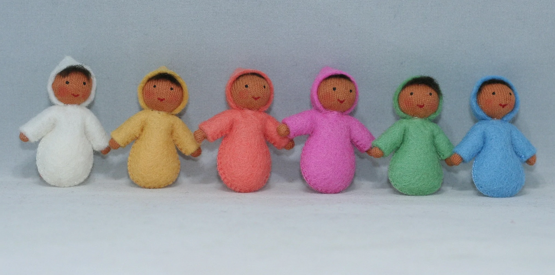 A set of miniature felt baby dolls in various colors